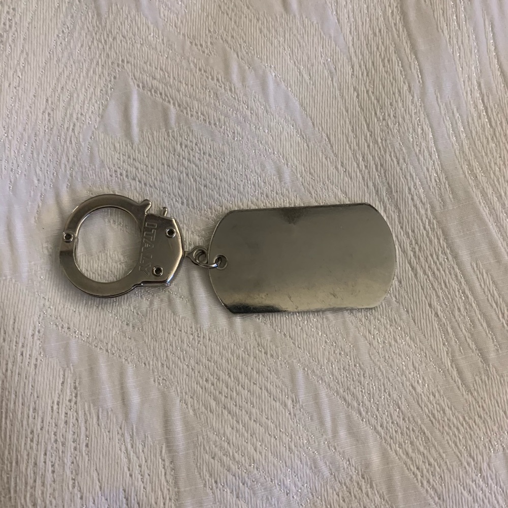 Dog tag, handcuff charm